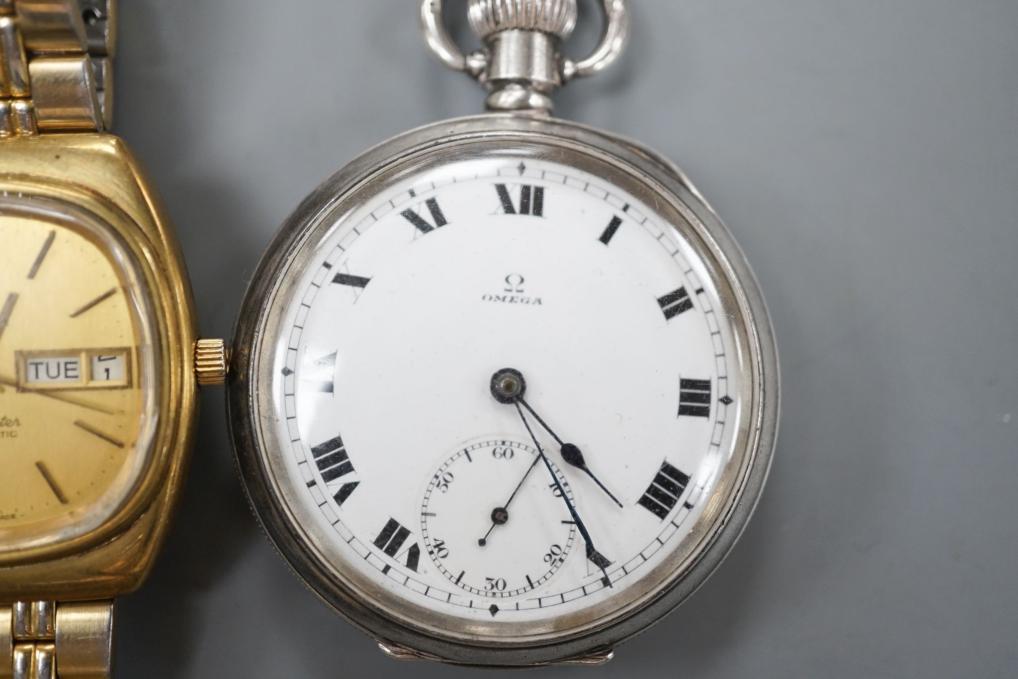 A George V silver Omega open face keyless pocket watch and a gold plated Omega Seamaster day/date automatic wrist watch.